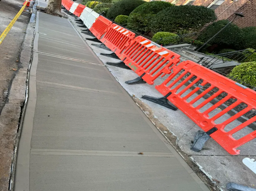 demonstration of a broken sidewalk after repaired